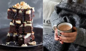Gestapelte Cheesecake Brownies mit Schokoladenglasur und Nüssen, daneben eine Tasse Kakao.