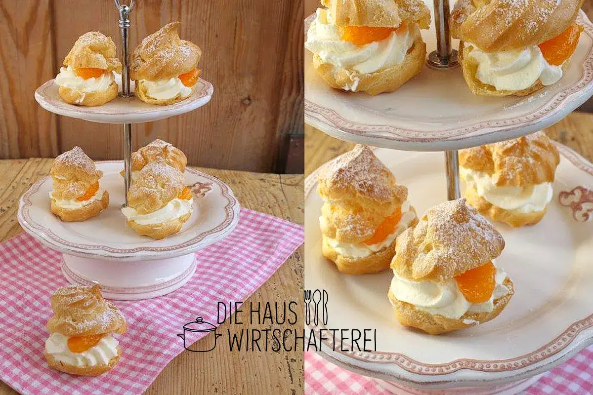 Windbeutel rezept: Köstliche Windbeutel mit Sahne und Mandarinenstücken, bestäubt mit Puderzucker, auf einer Etagere arrangiert.